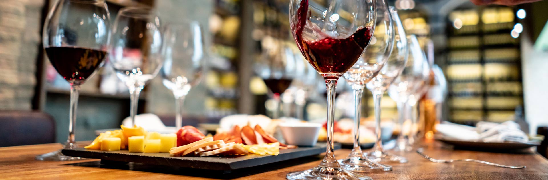 Pouring wine at a tasting room to illustrate Point of Sale.